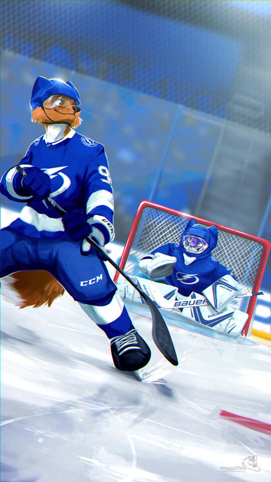 Picture of two hockey players in Tampa Bay Lightning colours. Dakota is looking back at Troy.